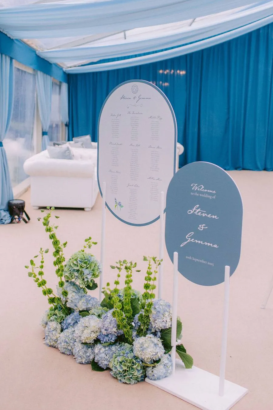 Welcome sign and seating plan with hydrangeas